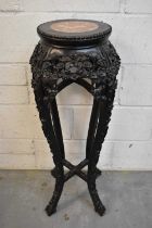 Late 19th century Chinese carved hardwood plant stand with marble inset top