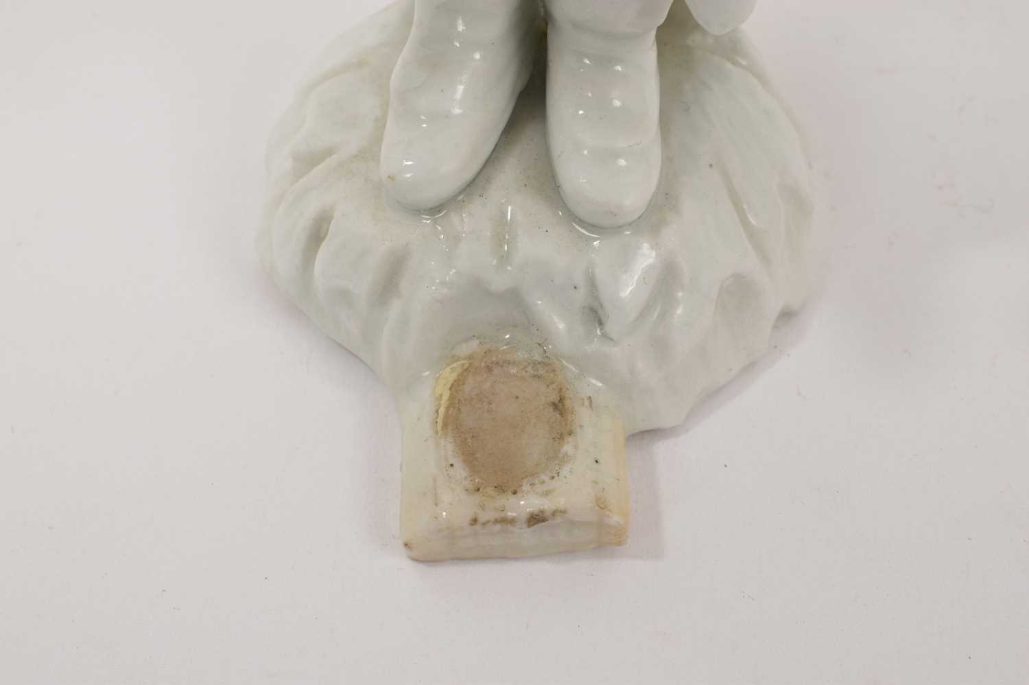 18th century white glazed porcelain figure of a man in a greatcoat, losses and restoration - Image 6 of 7