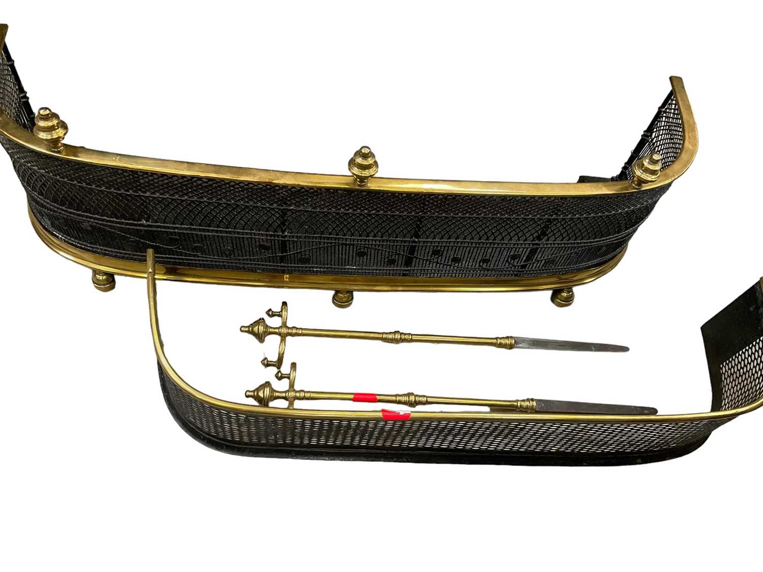 Two 19th century brass fenders and two pokers