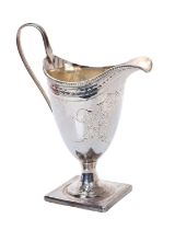 George III silver cream jug of helmet form, with engraved decoration,
