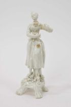 Lowestoft white glazed figure of a female lute player