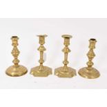 Pair of mid 18th century brass candlesticks and another pair. (4)