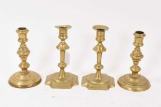 Pair of mid 18th century brass candlesticks and another pair. (4)