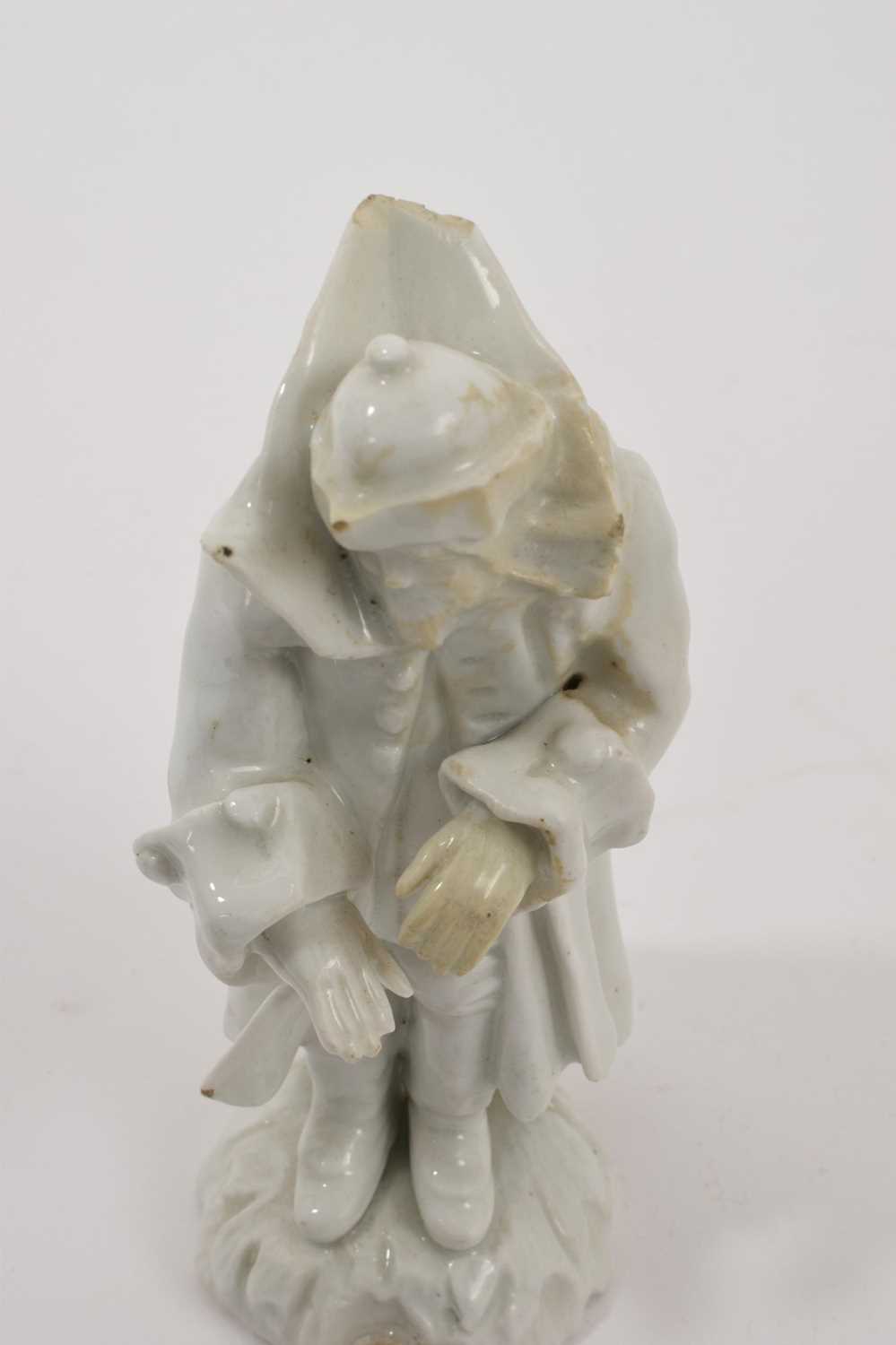 18th century white glazed porcelain figure of a man in a greatcoat, losses and restoration - Image 5 of 7