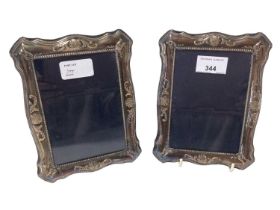 Pair contemporary silver photograph frames of vertical, shaped rectangular form