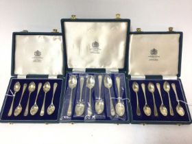 Three cases of silver feather edge tea and coffee spoons
