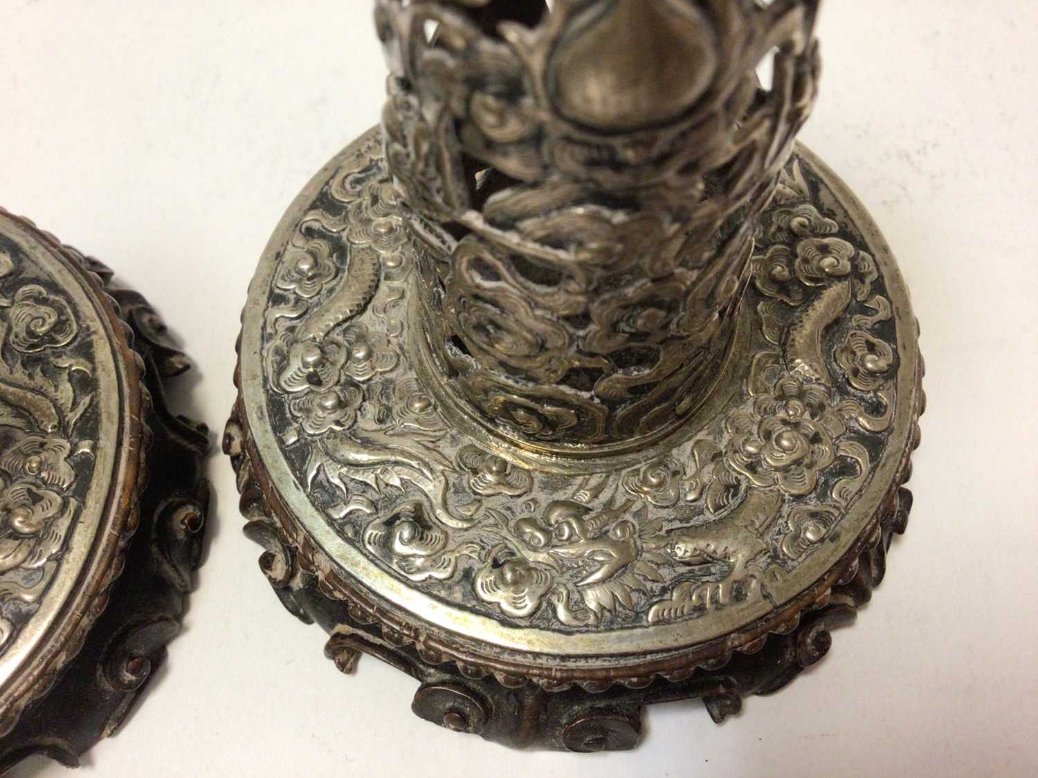 Pair of Chinese white metal candlesticks with pierced dragon decoration on carved wood bases - Image 6 of 6
