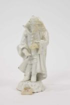 18th century white glazed porcelain figure of a man in a greatcoat, losses and restoration