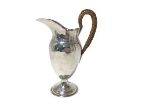 Edwardian silver hot water jug with wicker covered handle