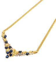 Sapphire and diamond necklace with oval mixed cut blue sapphires and brilliant cut diamonds in flora