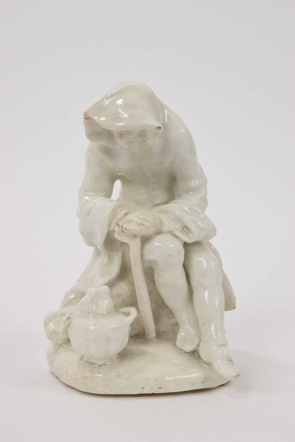 Bow white glazed porcelain figure of a man before a brazier emblematic of winter, probably Longton H