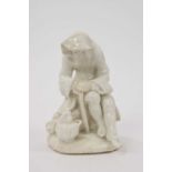 Bow white glazed porcelain figure of a man before a brazier emblematic of winter, probably Longton H