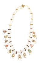 A fine antique Indian gold seed pearl and gem-set necklace with thirteen flower head clusters, each