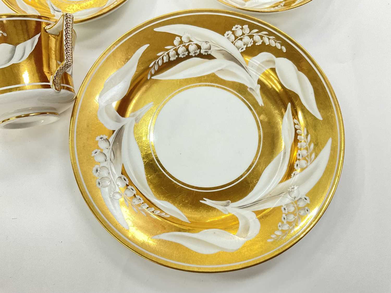 Wedgwood bone china gold ground Lily of the Valley teacup, two saucers and a plate - Image 5 of 10