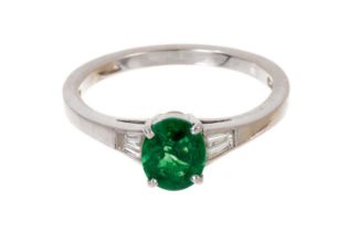 Green diopside and diamond ring with an oval green diopside measuring approximately 6.8 x 5.6mm flan