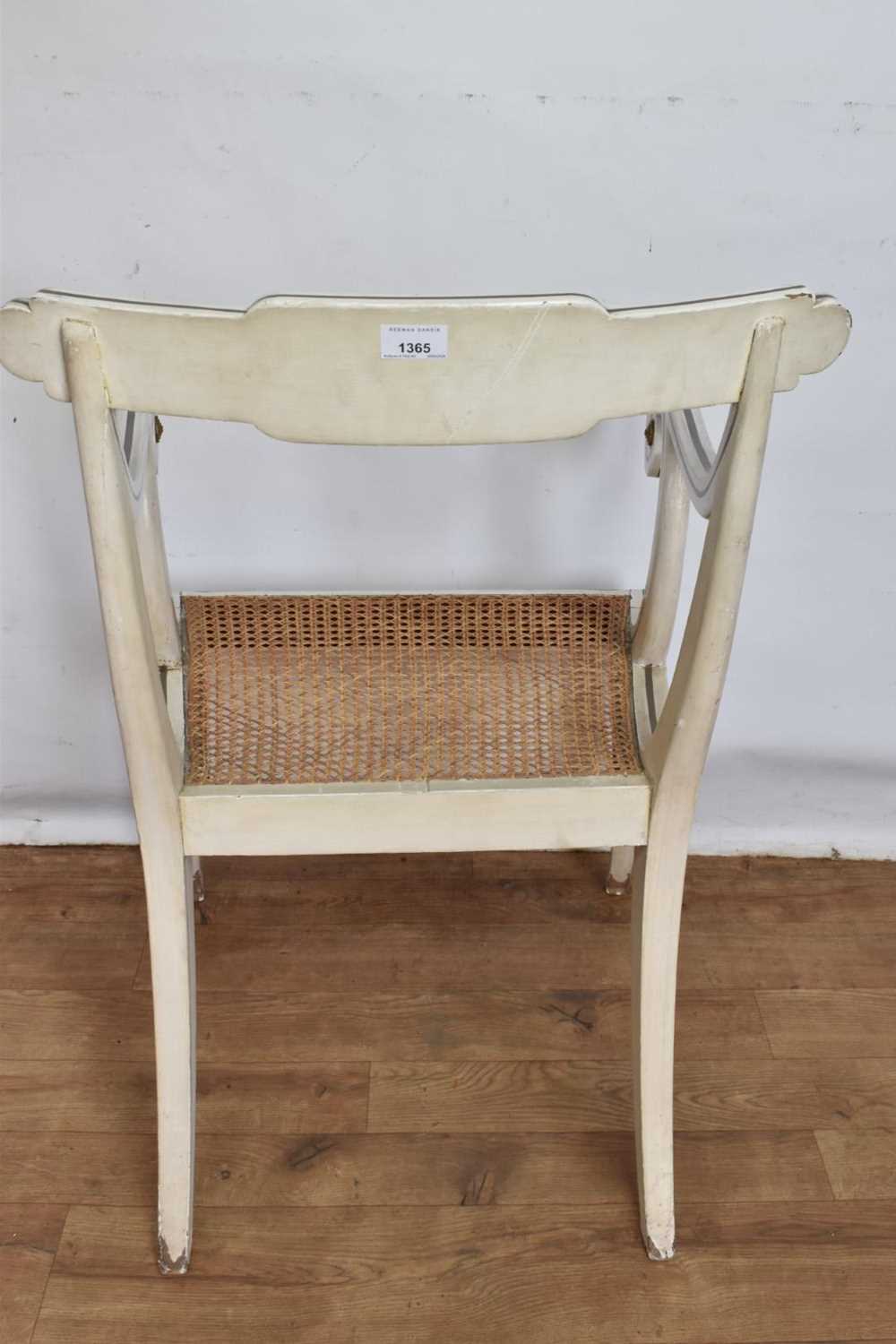 Pair of Regency style white painted and parcel gilt open elbow chairs with cane seats on sabre legs - Image 9 of 9