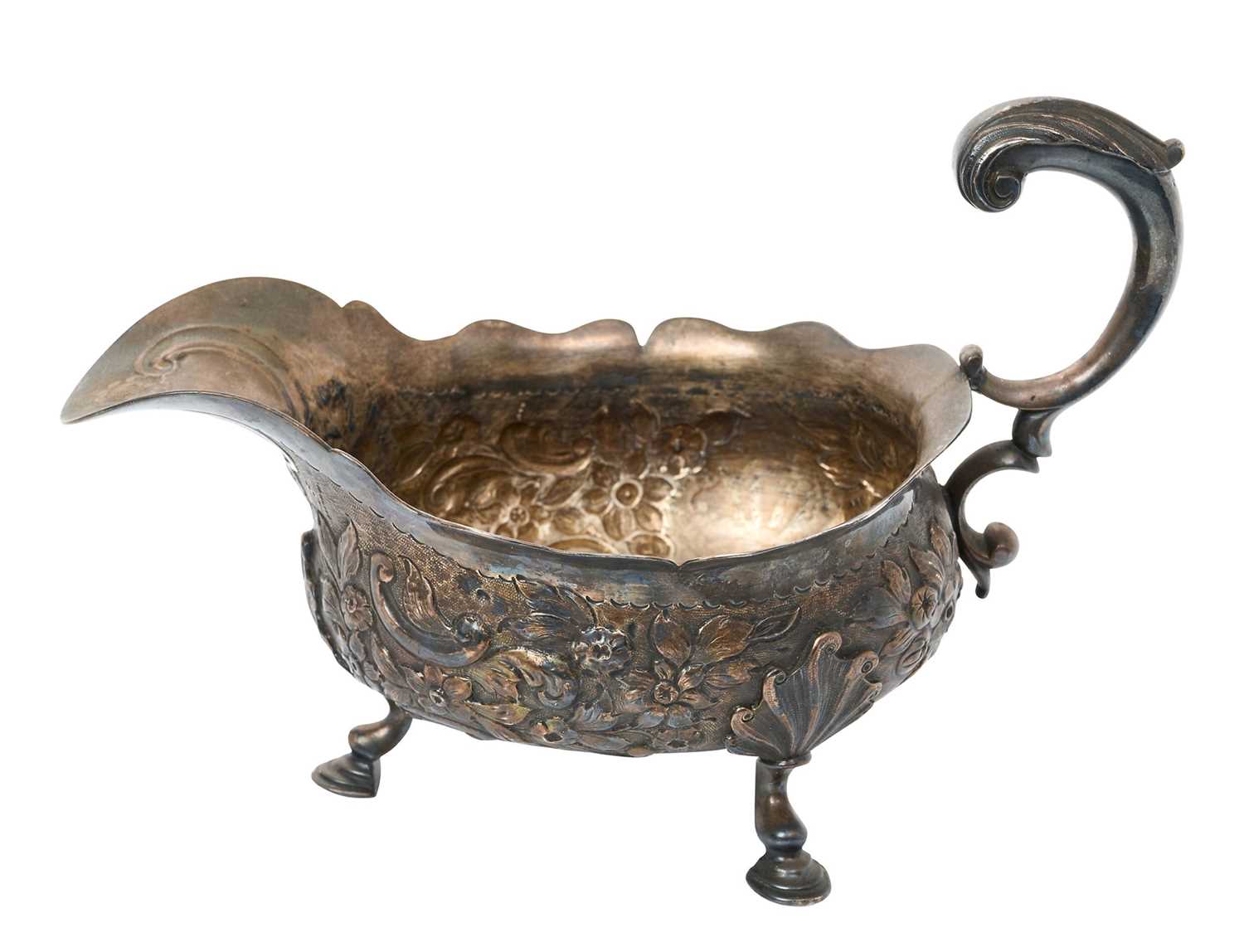 Mid 18th century embossed silver sauce boat