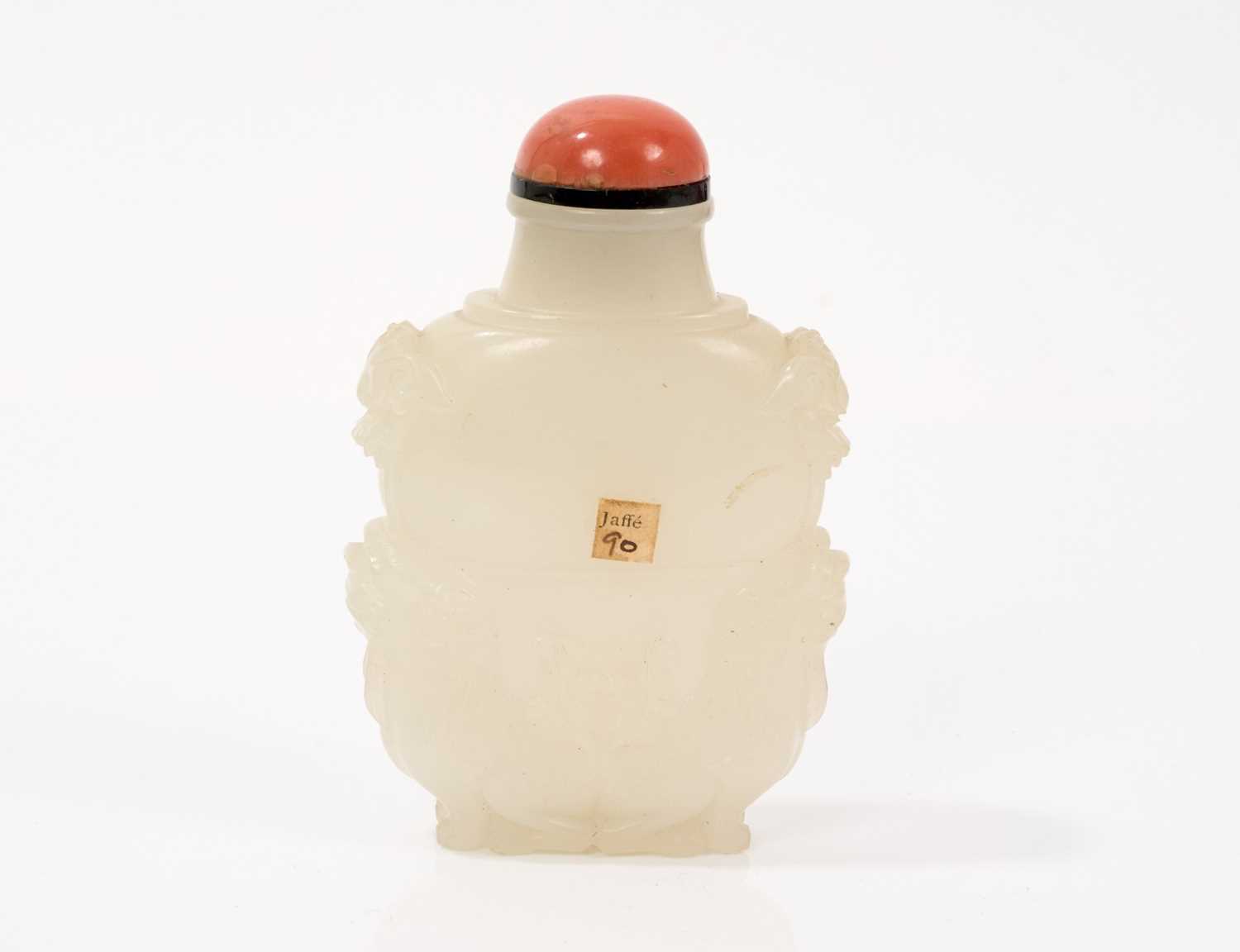 Finely carved celadon jade snuff bottle, with qilin supports