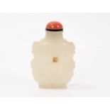 Finely carved celadon jade snuff bottle, with qilin supports