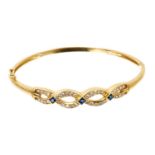 Sapphire and diamond hinged bangle with a platted design of single cut diamonds and three blue sapph