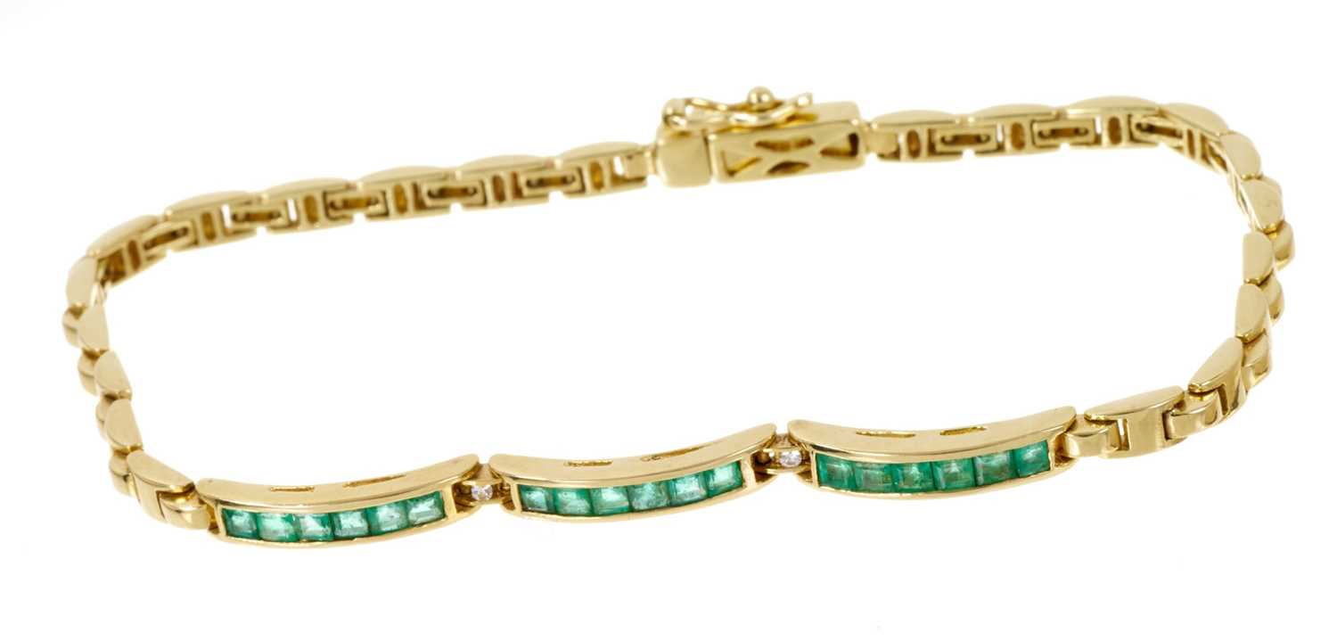 Emerald and diamond bracelet with three bands of calibre cut emeralds in channel setting interspaced - Image 2 of 2