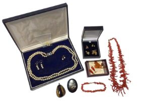 Group of jewellery to include a coral necklace, a cultured pearl two-strand necklace and earrings, p