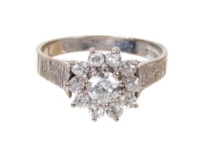Diamond cluster ring with a flower head cluster of diamonds