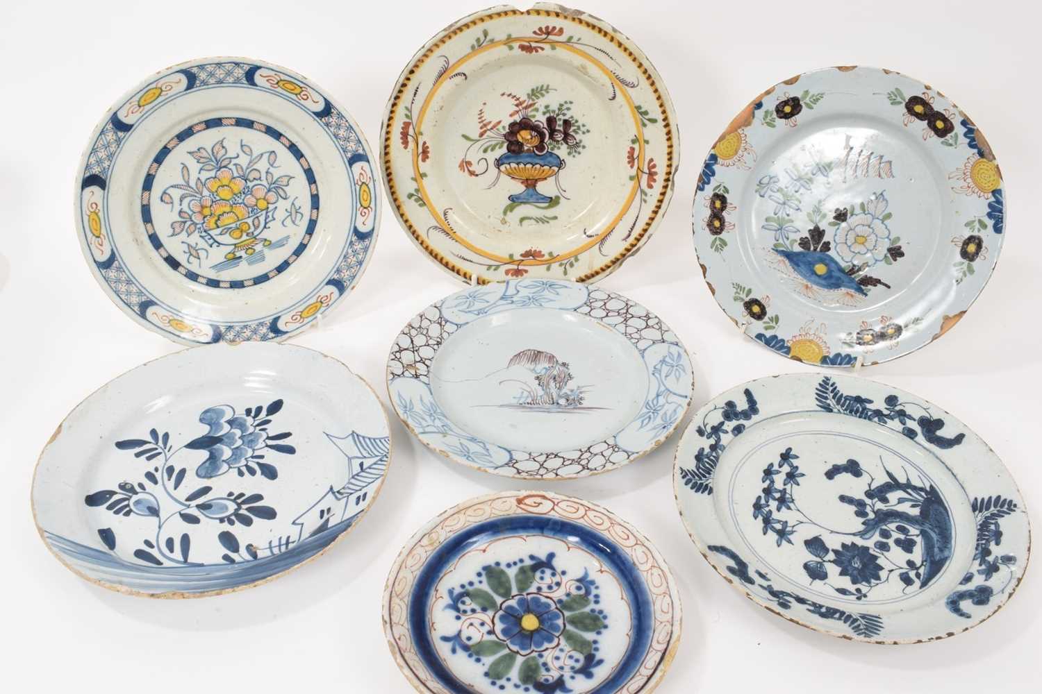 Seven assorted Delftware plates