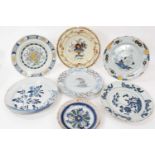 Seven assorted Delftware plates