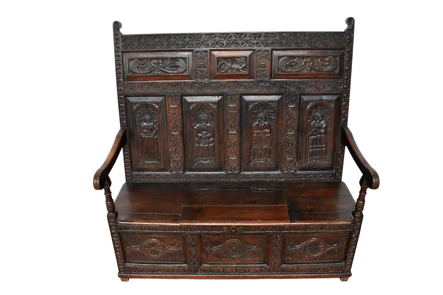 Elaborate carved oak settle