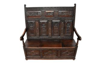 Elaborate carved oak settle