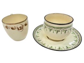 Wedgwood creamware tea bowl and trembleuse saucer, and a Wedgwood crested coffee cup
