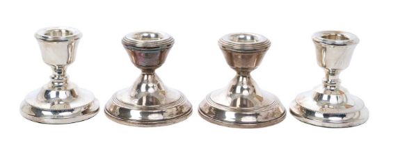 Two pairs of contemporary silver dwarf candlesticks