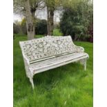 Victorian style white painted cast metal garden bench with lily pad and foliate design, 131cm wide.