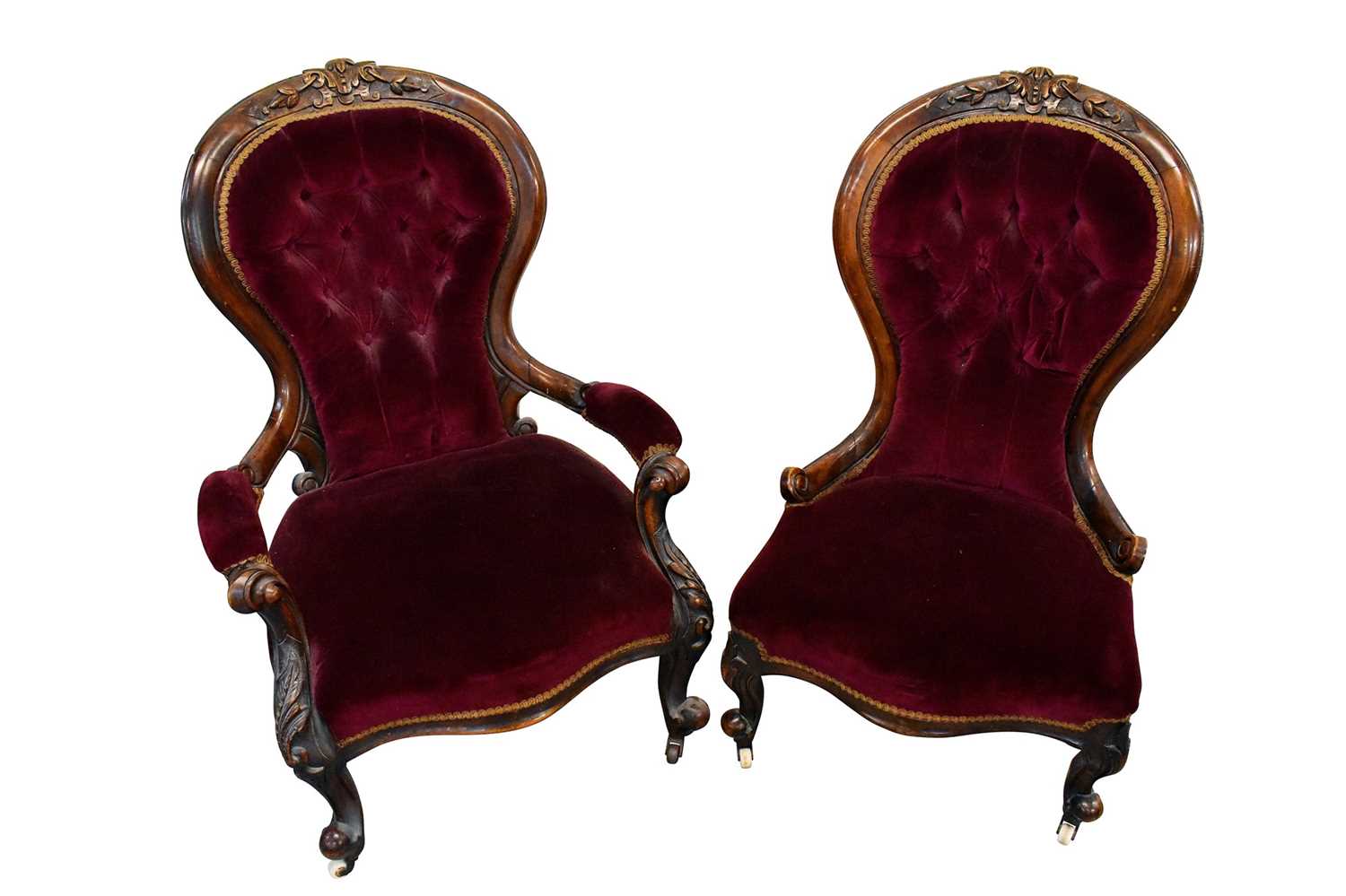 Pair of mid Victorian his and hers upholstered easy chairs