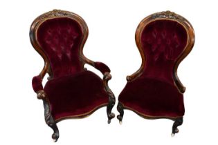 Pair of mid Victorian his and hers upholstered easy chairs