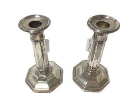 Pair of silver octagonal candlesticks