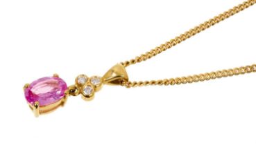 Pink sapphire and diamond pendant necklace with an oval mixed cut pink sapphire measuring approximat