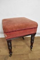 Early 19th century square foot stool, on turned legs and castors