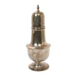1930s silver caster of baluster form with a pierced and engraved slip in cover