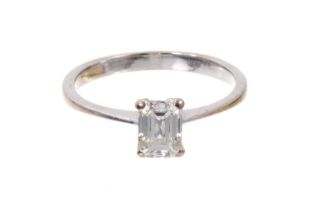 Diamond single stone ring with a rectangular emerald-cut diamond with a G.I.A. Diamond Report statin