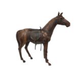 Large leather covered wooden horse in the style of Liberty