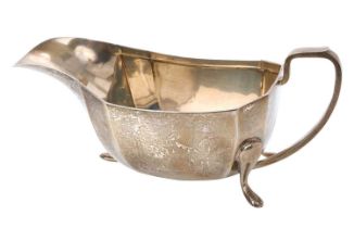 Late 1940s silver sauce boat of faceted form, with angular loop handle