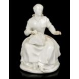 White glazed porcelain figure of a lacemaker