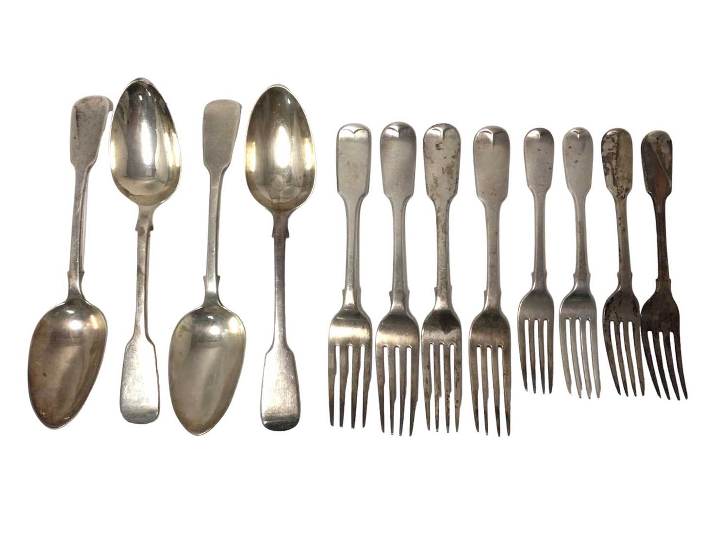 Set of four Victorian silver Fiddle pattern table spoons, with engraved initials,