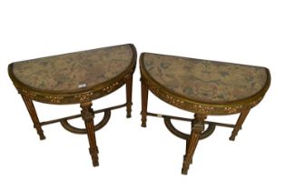 Pair of late 19th / early 20th century gilt demi-lune side tables, utilising early fabric panels.
