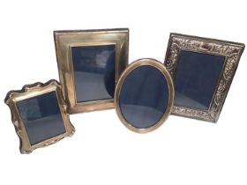 Three silver photograph frames, various sizes and one silver plated (4)