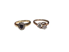18ct gold sapphire and diamond cluster ring and a 9ct gold synthetic two stone ring (2)