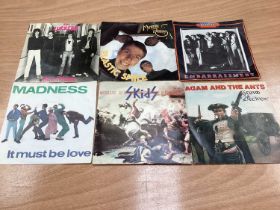 Box of single records including The Sex Pistols, Clash, Lurkers, Pretenders, XTX, Sham 69, Purple He