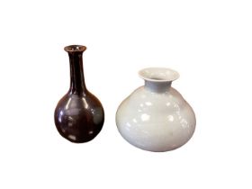 Yeap Poh Chap (1927-2007) two porcelain vases - one of gourd shape covered in celadon glaze and inci